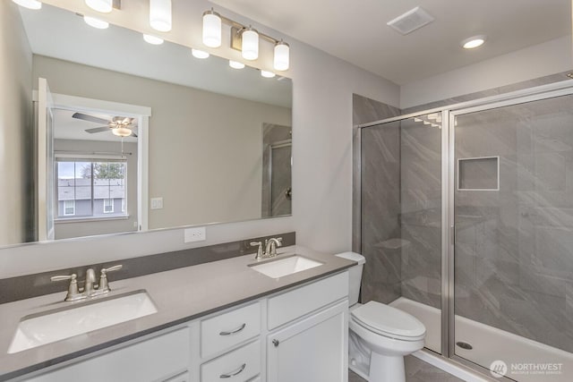 full bathroom with visible vents, a sink, and a shower stall