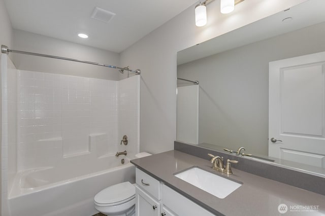 bathroom featuring bathtub / shower combination, visible vents, vanity, and toilet