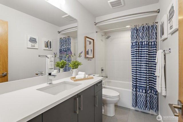 full bathroom with tile patterned flooring, toilet, vanity, visible vents, and shower / tub combo with curtain