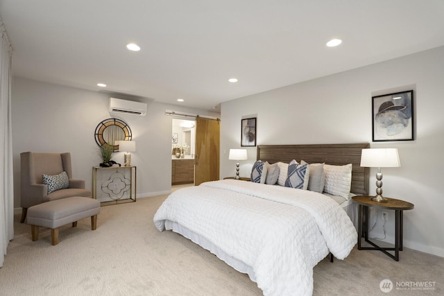 bedroom with an AC wall unit, a barn door, recessed lighting, and light colored carpet