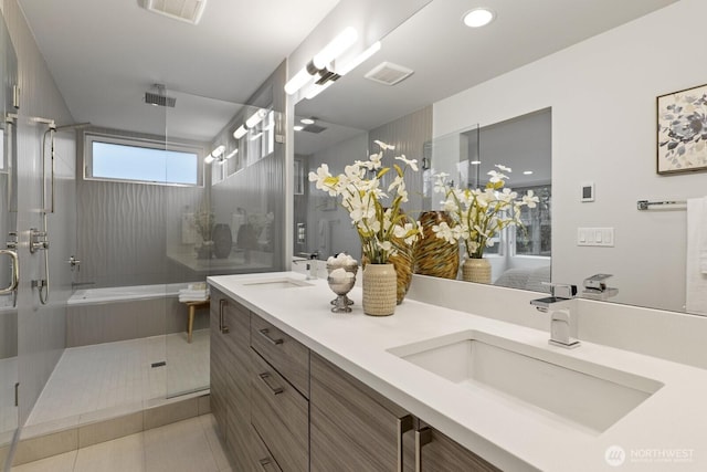 full bath with an enclosed shower, tile patterned flooring, a sink, and visible vents