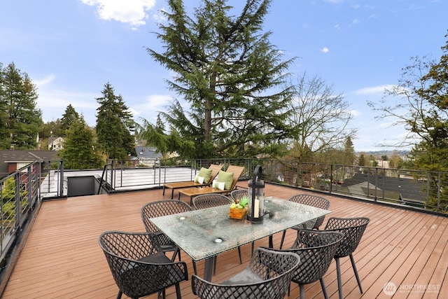 wooden terrace featuring outdoor dining area