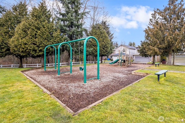 community playground with a yard and fence