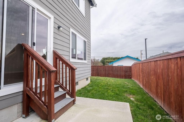 view of yard with a fenced backyard