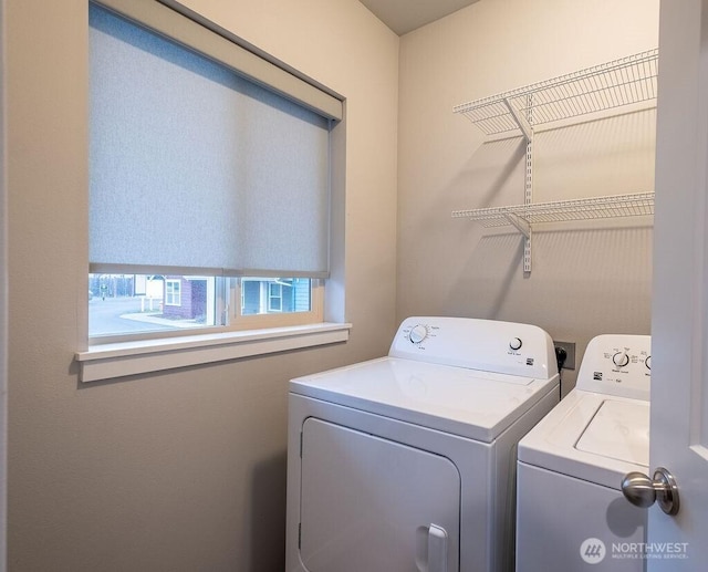 washroom with laundry area and washer and dryer