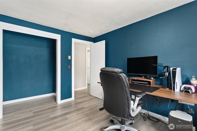 office with baseboards and wood finished floors