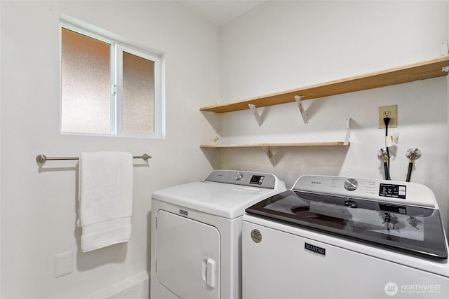 laundry area with separate washer and dryer and laundry area