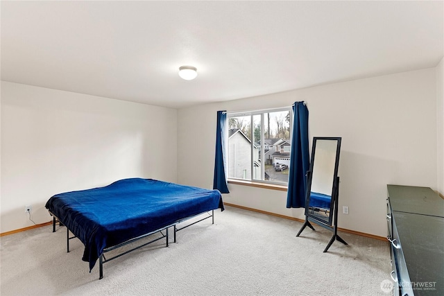 bedroom featuring baseboards and carpet floors