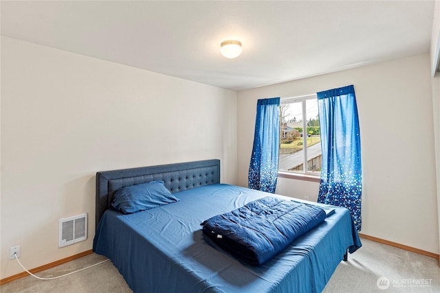 carpeted bedroom with baseboards and visible vents