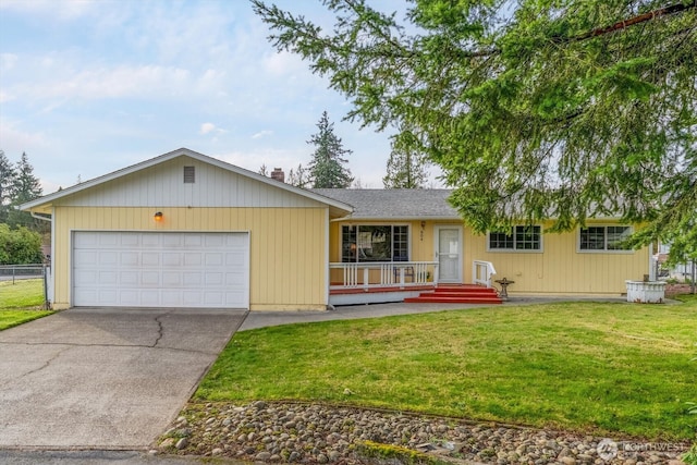 ranch-style house featuring a front yard, an attached garage, fence, and driveway