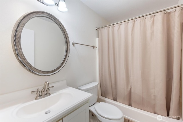 bathroom featuring shower / bath combination with curtain, toilet, and vanity