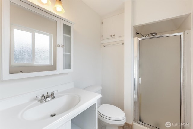 full bath with a shower stall, toilet, and vanity