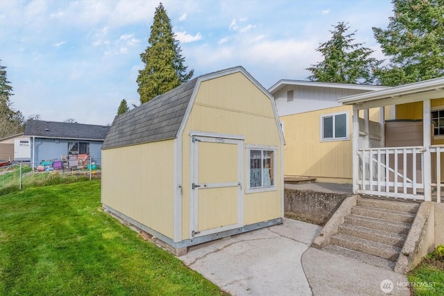 view of shed featuring fence