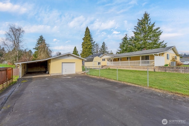 single story home with central air condition unit, aphalt driveway, fence, a front yard, and a garage