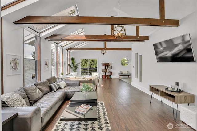 living area featuring lofted ceiling with beams, baseboards, wood finished floors, and a notable chandelier