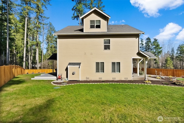 back of property featuring crawl space, a patio area, a yard, and a fenced backyard