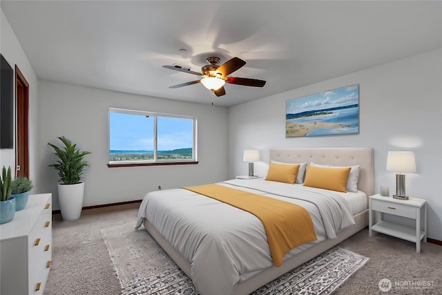 bedroom with light carpet, baseboards, and a ceiling fan