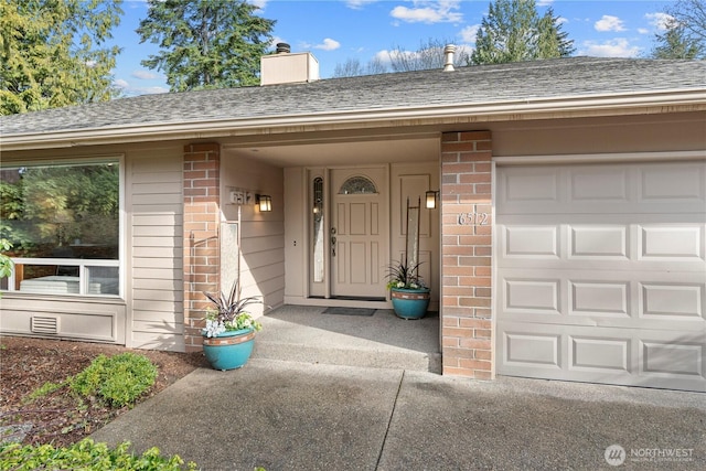 property entrance featuring brick siding, a chimney, and roof with shingles