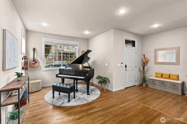 sitting room featuring recessed lighting, baseboards, and light wood finished floors