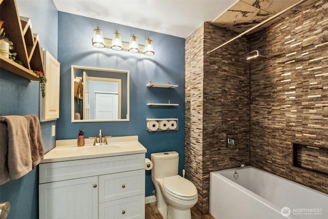 full bathroom featuring toilet, vanity, wood finished floors, and shower / bathing tub combination