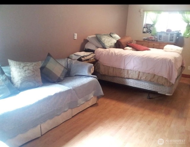 bedroom with light wood-type flooring