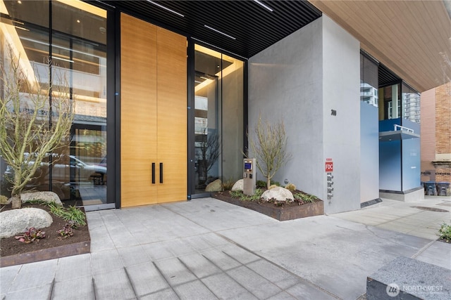 doorway to property with stucco siding