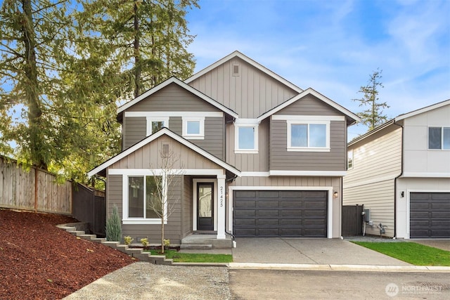 view of front facade with driveway, an attached garage, fence, and board and batten siding