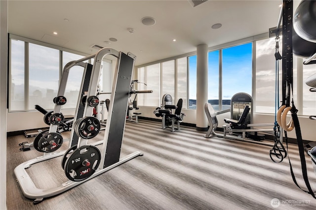 workout area featuring a water view and visible vents