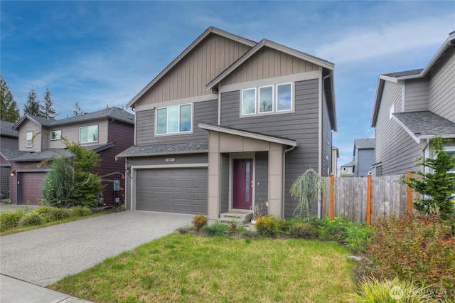 view of front of home featuring a front yard and a garage