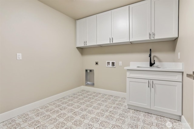 laundry room with cabinet space, baseboards, electric dryer hookup, washer hookup, and a sink