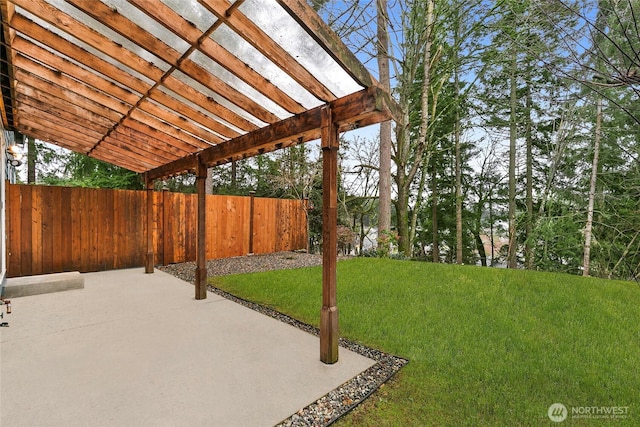 view of yard with a patio area, fence, and a pergola