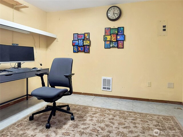 office space featuring visible vents and baseboards