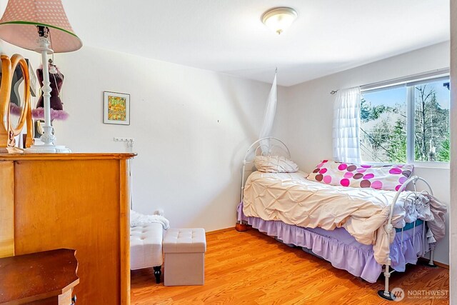 bedroom with light wood-type flooring