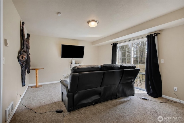 carpeted home theater featuring visible vents and baseboards