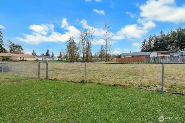 view of yard featuring a gate and fence