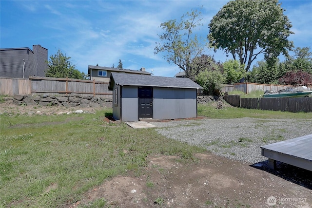 view of outdoor structure with a lawn