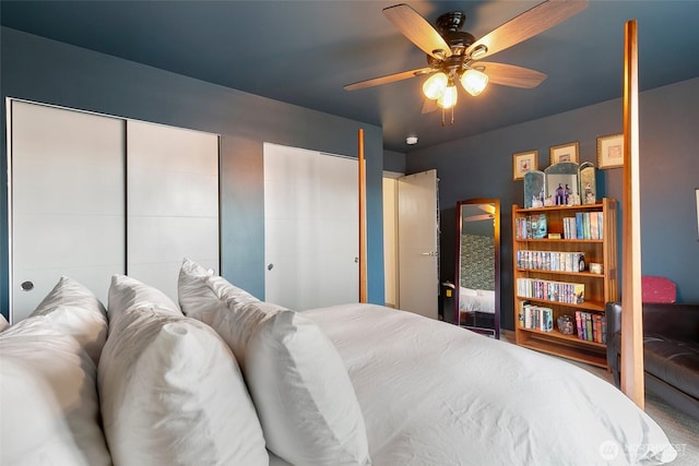 bedroom with multiple closets and a ceiling fan