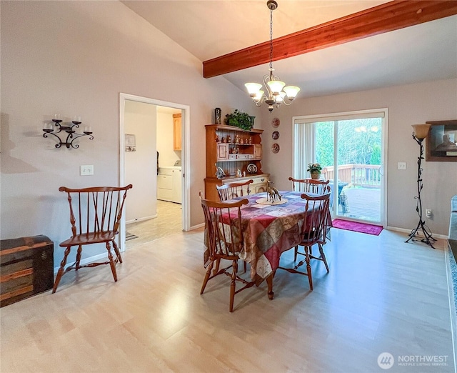 dining area featuring vaulted ceiling with beams, light wood-style flooring, washer / clothes dryer, and a notable chandelier