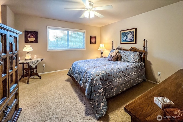 carpeted bedroom featuring ceiling fan and baseboards