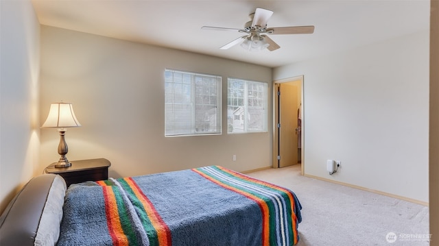 bedroom with baseboards, ceiling fan, and light colored carpet