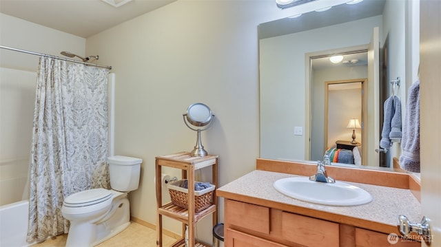 bathroom with toilet, vanity, and shower / bathtub combination with curtain