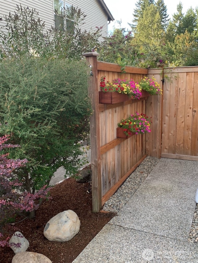 view of gate with fence