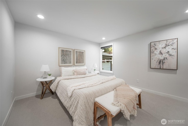 carpeted bedroom featuring baseboards and recessed lighting