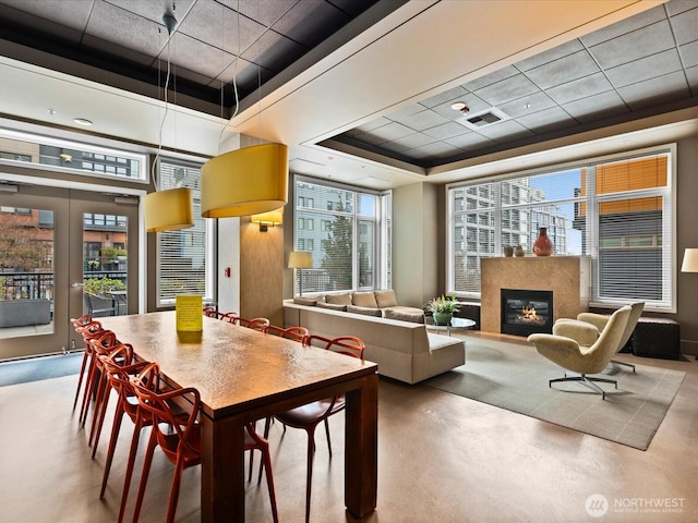 lobby featuring a view of city and visible vents