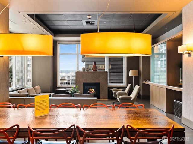 kitchen with a view of city and a lit fireplace