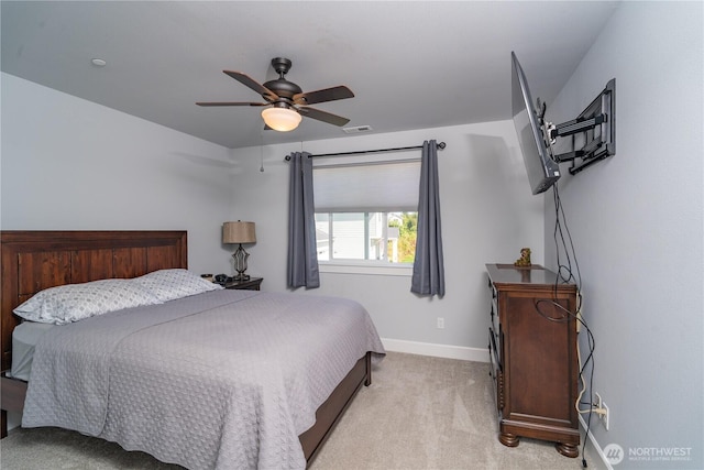 bedroom with baseboards, ceiling fan, visible vents, and light colored carpet