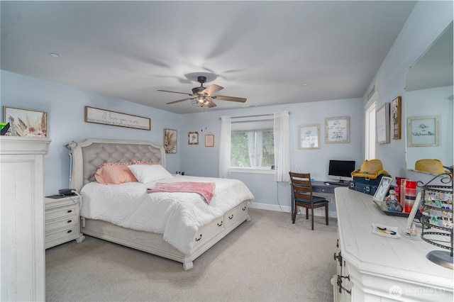 bedroom with light carpet, baseboards, and a ceiling fan