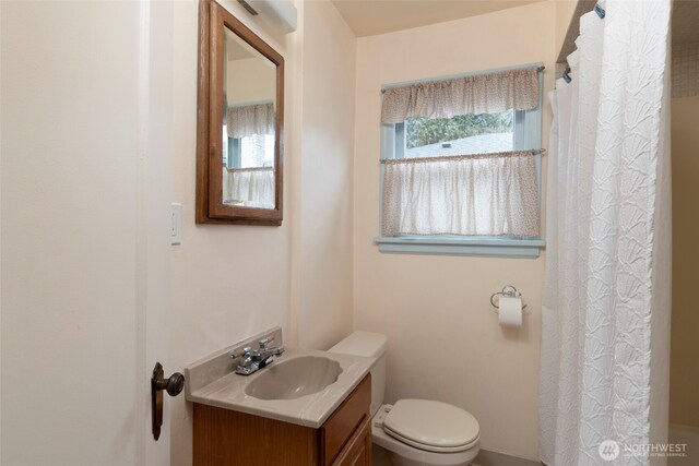 full bath featuring toilet and vanity