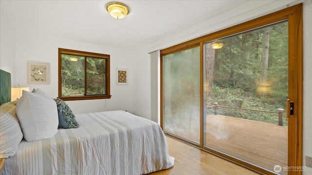 bedroom with a closet and wood finished floors