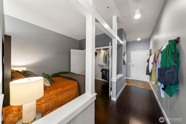 interior space with hardwood / wood-style floors and baseboards